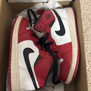 Red black and white Jordan Mids